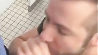 Handsome guy sucks dick in restroom stall 2