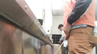 Fellows in the urinals taking seep7777