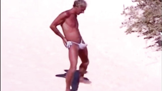 Tanned guy on beach in tiny string thong (temporarily!) 4