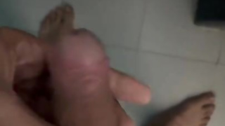 Ultra-Kinky fellow wanking before taking a douche.