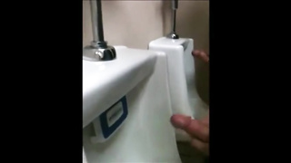 two slim dicks getting wanked at the urinals 6