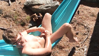 Canadian fellow faps his uncircumcised sausage in a hammock on a super hot and sunny day