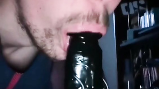 He sucks his dildo with passion