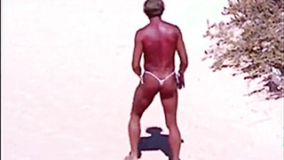 Tanned guy on beach in tiny string thong (temporarily!) 12