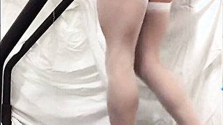 Crossdresser in White Stockings on Treadmill