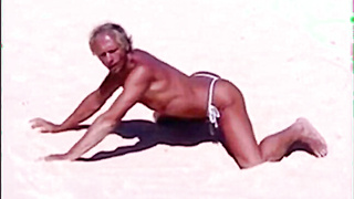 Beach Striptease: Tanned Hunk Bares All