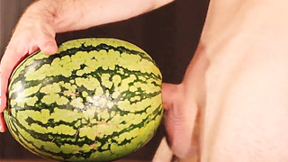 Muscular Stud Fucks and Cums on Watermelon