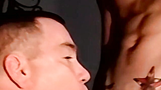 Inked marine blown by mature homo during stroking session