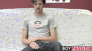 Adorable gay guy Danny jerks off his dick on couch solo