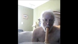Old man sucks a big dildo